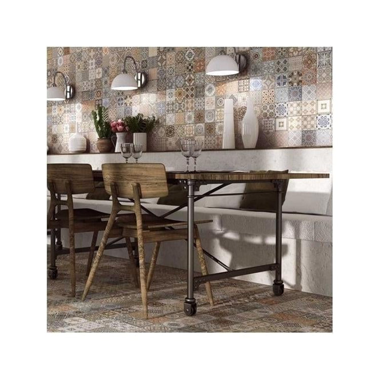 Provenza Decor tile by realonda ceramics tiled on a dining room floor.
