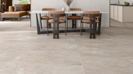 open plan livingroom and kitchen with ivory stone effect floor tiles installed