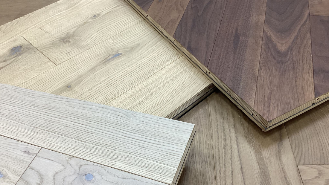 blog banner image for engineered wooden flooring showing numerous engineered wooden floor samples laid out at our ballymena showroom in northern ireland