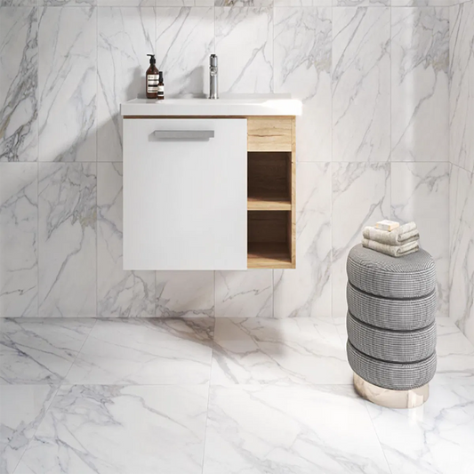nora white 60x60 floor tile by ceramica impex tiled on the floor in a bathroom with the 600x300 wall tile version tiled on the wall of the bathroom