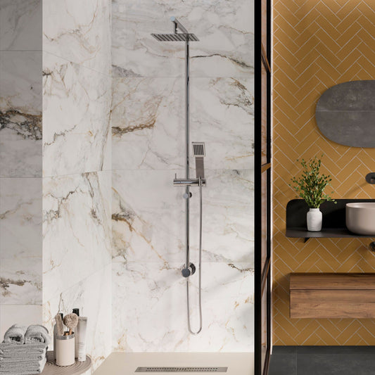 pisa gold large format porcelain tiles on the wall of a bathroom by pamesa